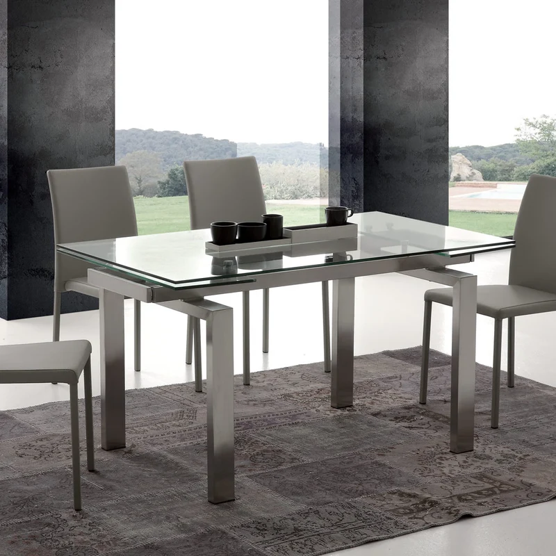 Manhattan - Tavolo moderno allungabile piano in vetro e gambe acciaio satinato cm 140/200x80x75h